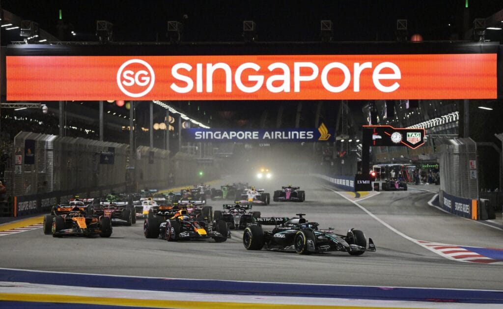 Russell Triumphs in Singapore Norris Battles to Podium