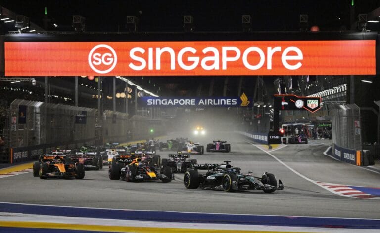 Russell Triumphs in Singapore Norris Battles to Podium